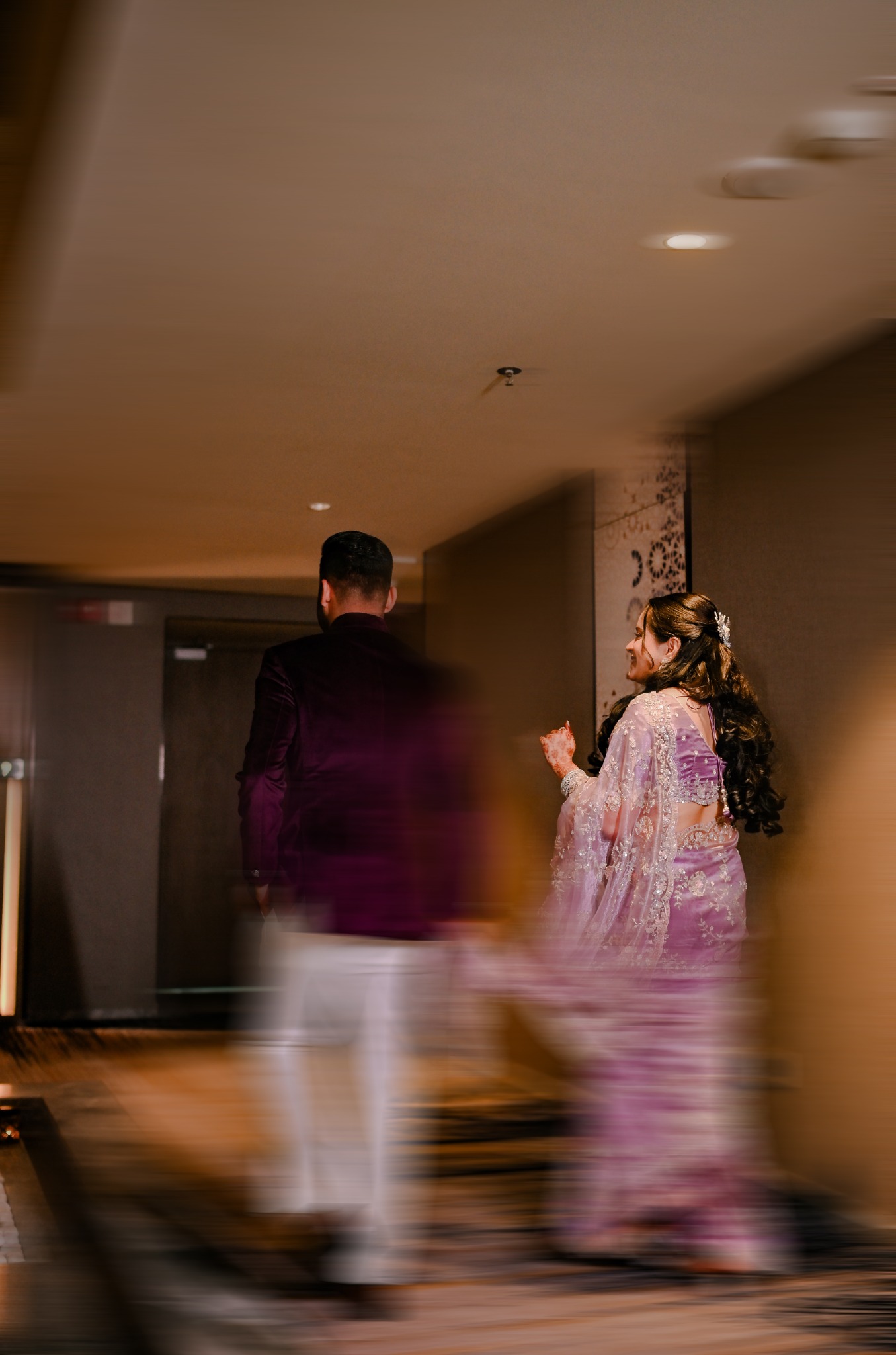 Engagement Couple Walking Through Hallway